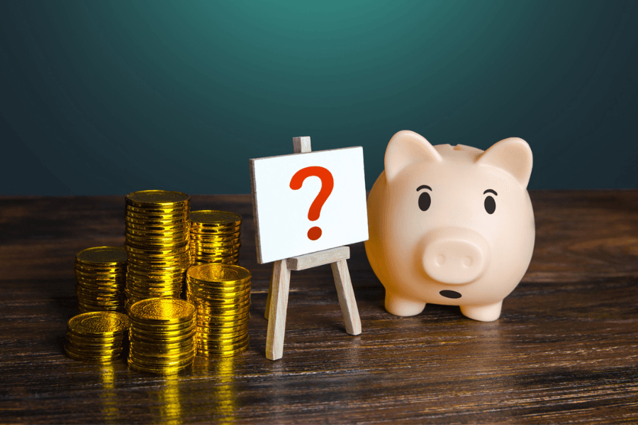 Price Transparency; money and piggy bank with a question mark symbolizing reimbursement rate mysteries
